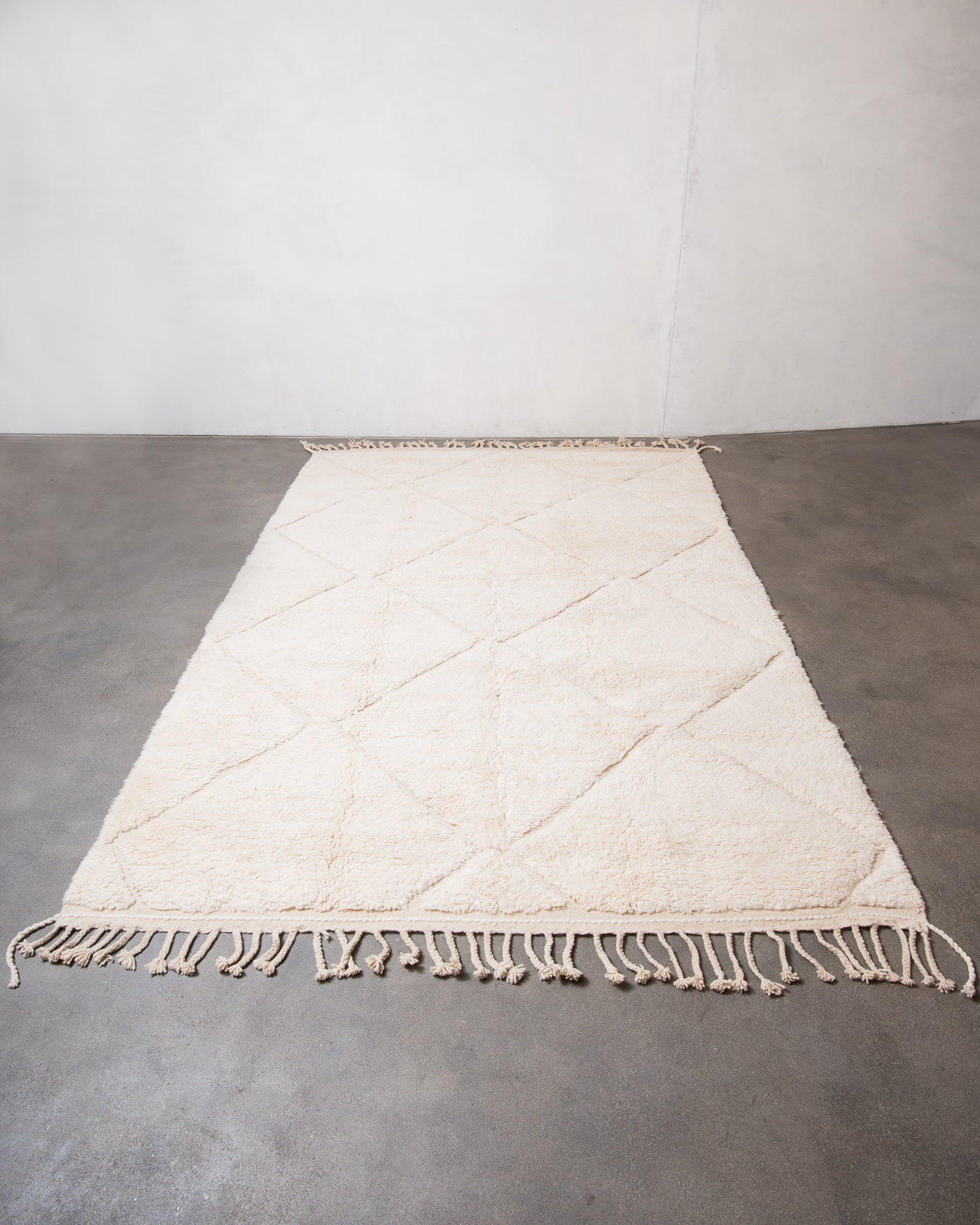 Modern, designer, handcrafted Berber rug from Morocco. Beniourain carpet with minimalist design, natural wool pile and a fluffy texture.